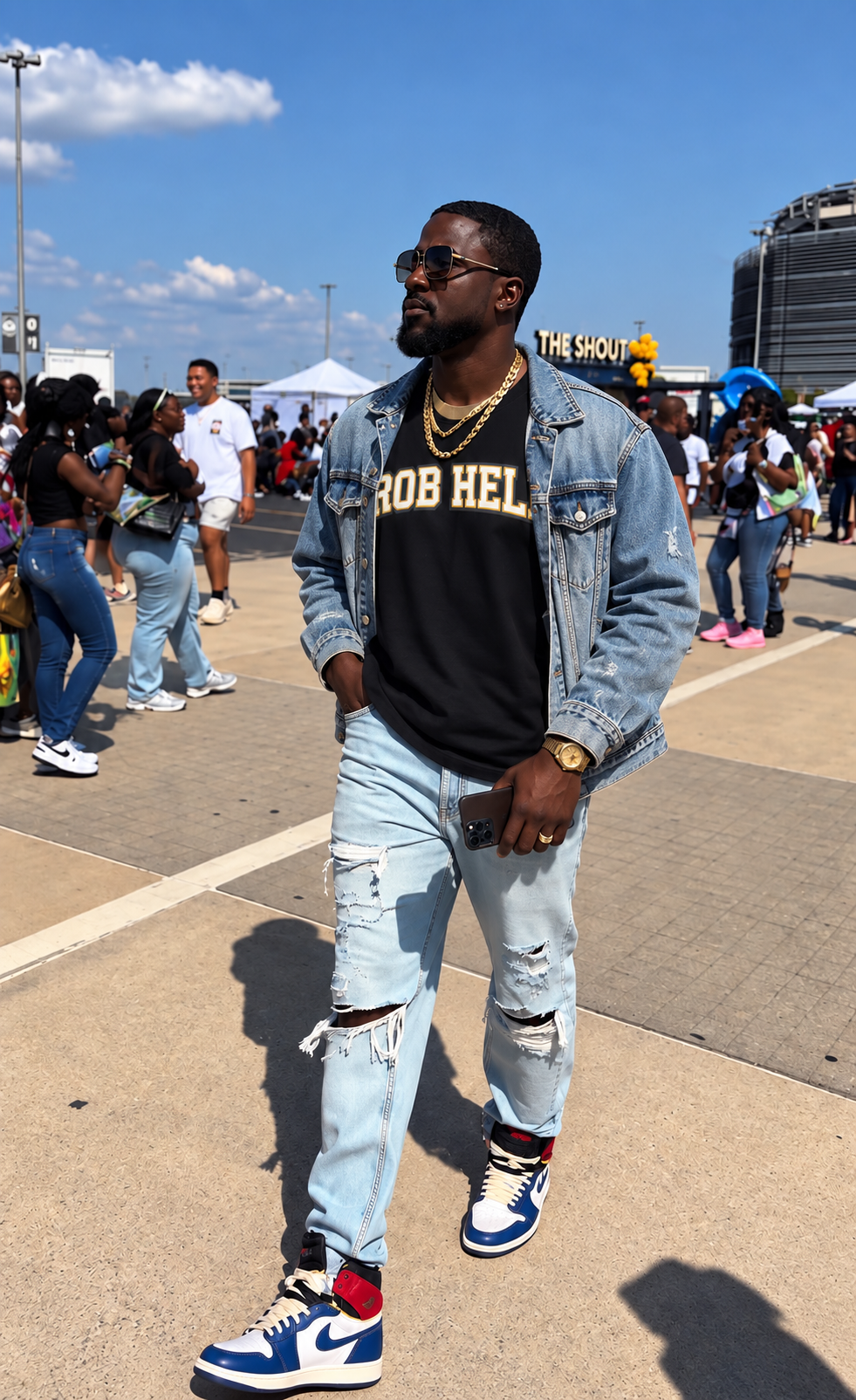 Stylish man wearing a black tee with the text "ROB HELL" on it.